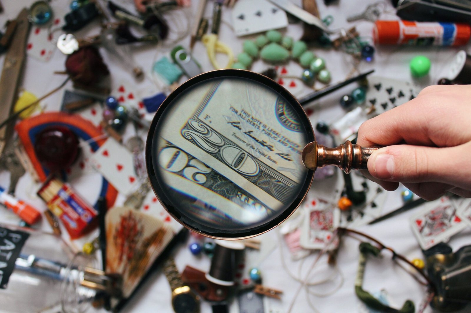 magnifying glass set on cash